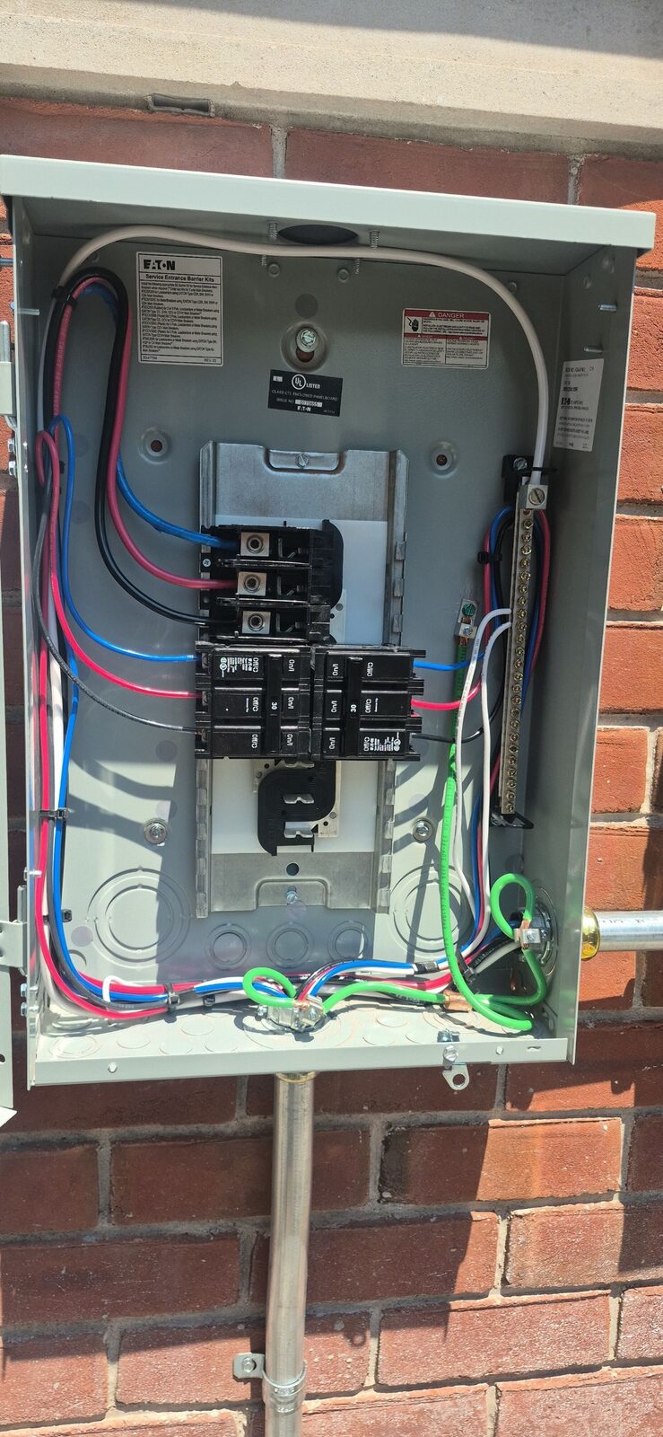 A tidy, color-coded electrical panel from a solar install