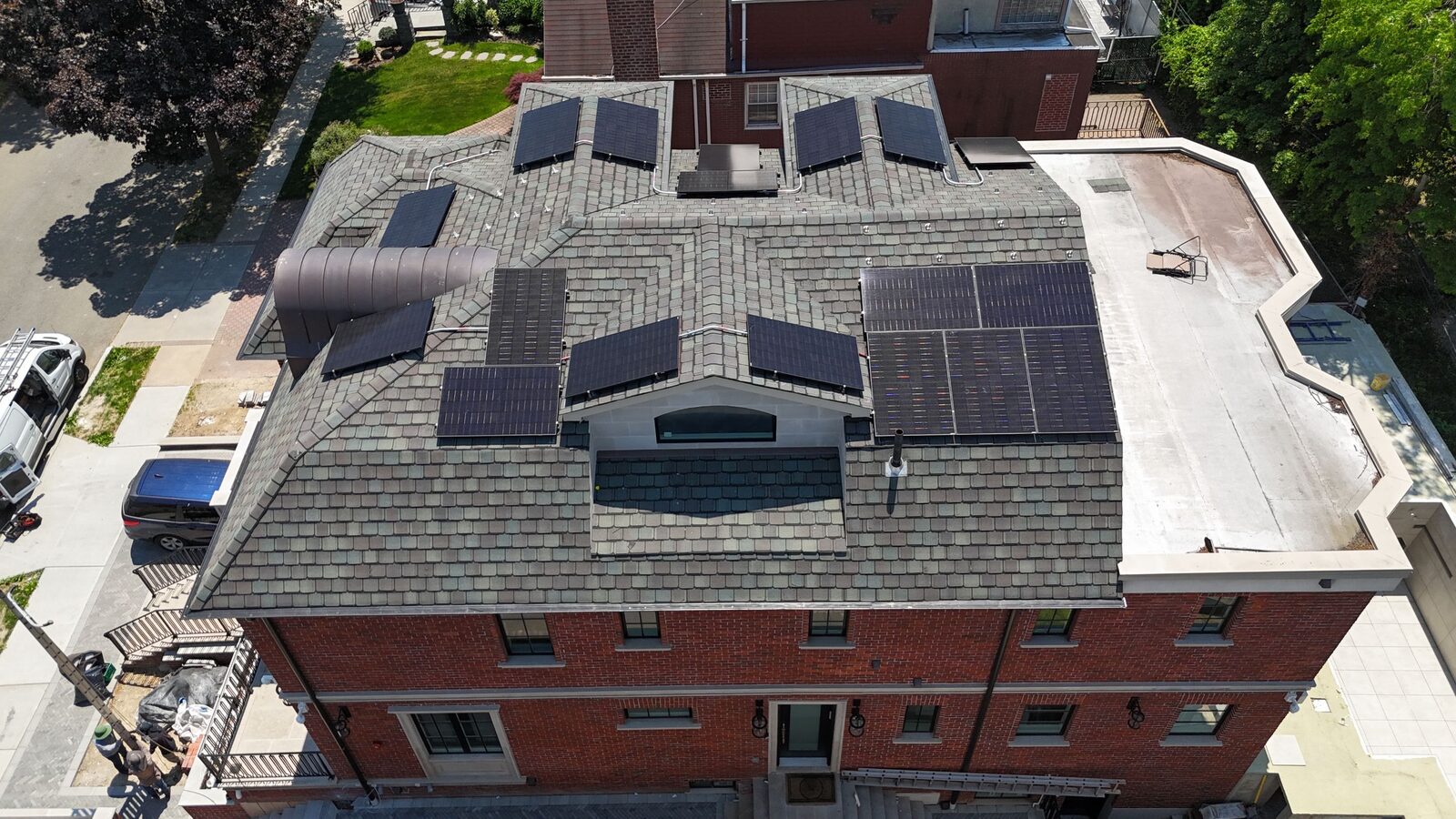 Aerial view of a finished rooftop solar array on a New York home